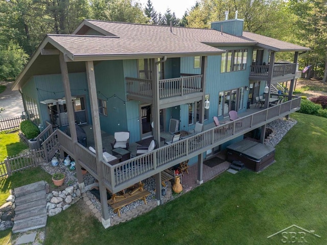 4394 N Francis Shores Ave, Sanford, MI 48657 - rear view of property featuring a shingled roof, a balcony, a wooden deck, and stairs