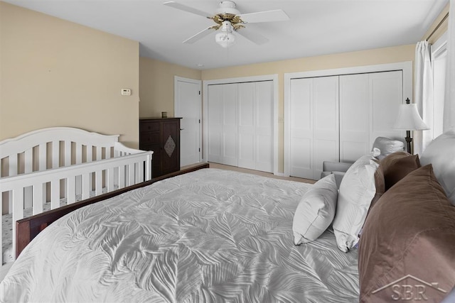 4394 N Francis Shores Ave, Sanford, MI 48657 - bedroom featuring multiple closets and ceiling fan