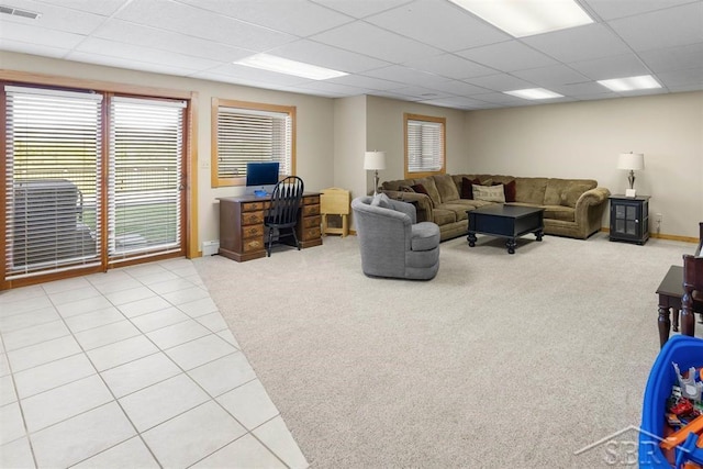 4394 N Francis Shores Ave, Sanford, MI 48657 - carpeted living room featuring a paneled ceiling, healthy amount of natural light, and an office area