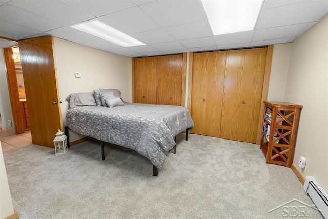 4394 N Francis Shores Ave, Sanford, MI 48657 - carpeted bedroom featuring baseboard heating and a drop ceiling