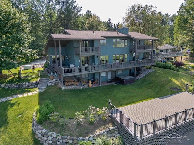4394 N Francis Shores Ave, Sanford, MI 48657 - back of property featuring a balcony