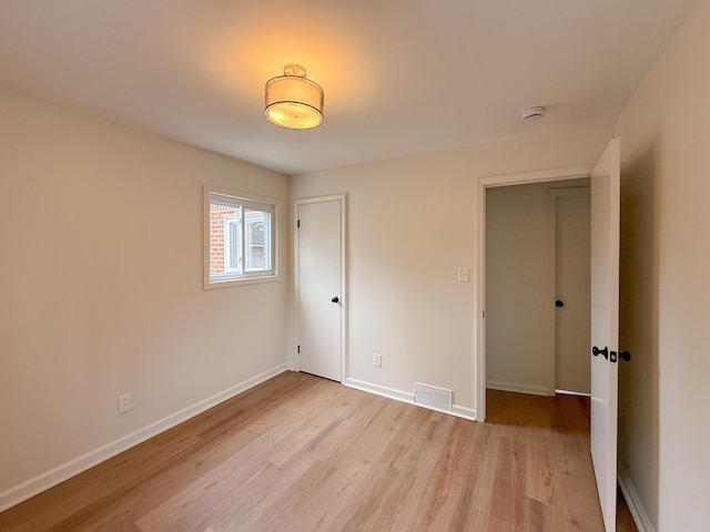 5016 E Outer Dr, Detroit, MI 48234 - unfurnished bedroom with light wood-style floors and a closet