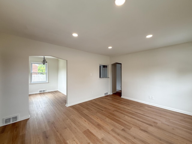 5016 E Outer Dr, Detroit, MI 48234 - unfurnished room with wood finished floors, recessed lighting, and arched walkways