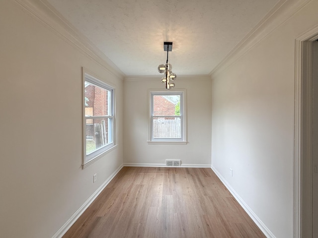 5016 E Outer Dr, Detroit, MI 48234 - unfurnished dining area featuring wood finished floors, ornamental molding, and a textured ceiling