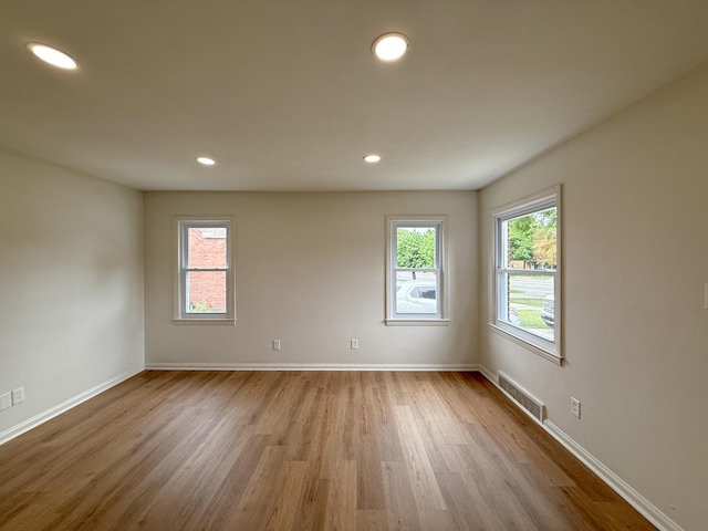 5016 E Outer Dr, Detroit, MI 48234 - empty room with wood finished floors and recessed lighting