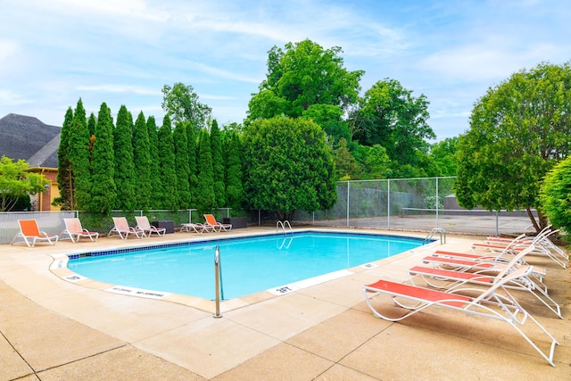 8597 Mathias Dr Unit 42, Grosse Ile, MI 48138 - community pool with a patio
