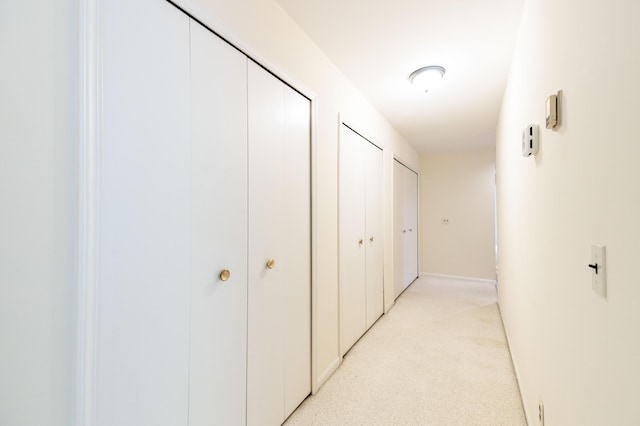 8597 Mathias Dr Unit 42, Grosse Ile, MI 48138 - corridor featuring light carpet