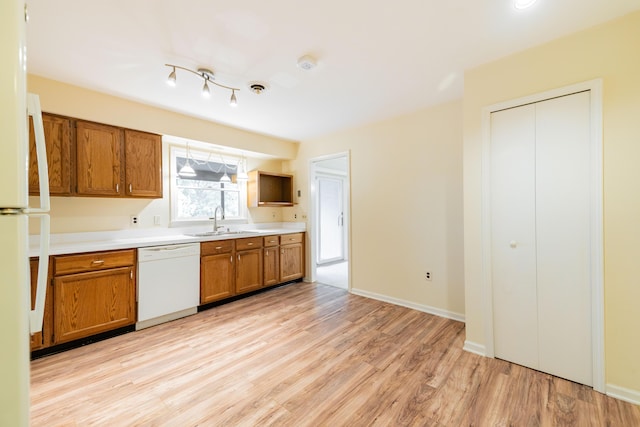 8597 Mathias Dr Unit 42, Grosse Ile, MI 48138 - kitchen featuring white appliances, brown cabinetry, light wood-type flooring, light countertops, and open shelves