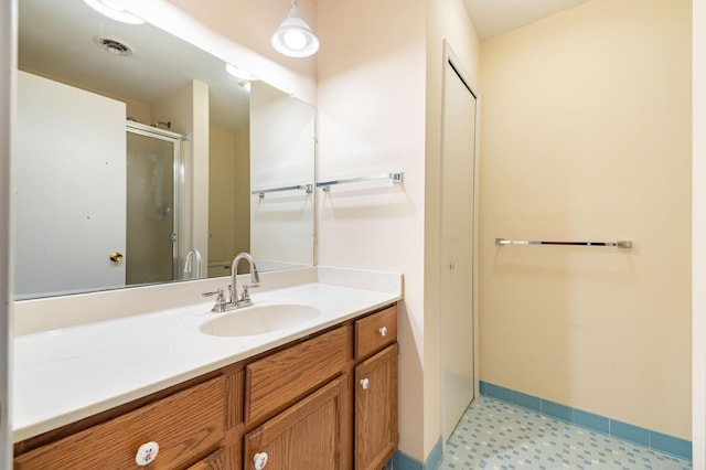 8597 Mathias Dr Unit 42, Grosse Ile, MI 48138 - full bath featuring a shower stall, vanity, and tile patterned floors