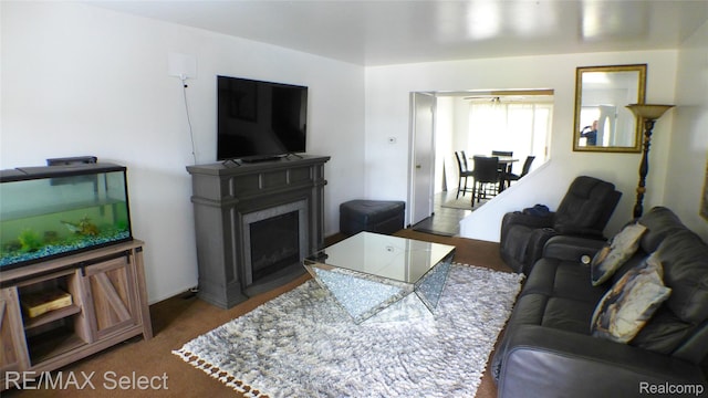 2633 Orchard Ln, Flint, MI 48504 - carpeted living room with a fireplace with flush hearth