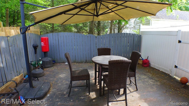 2633 Orchard Ln, Flint, MI 48504 - fenced backyard with a patio area and outdoor dining area