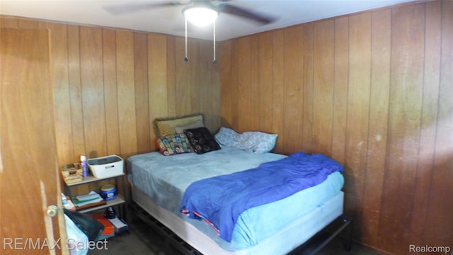 2633 Orchard Ln, Flint, MI 48504 - bedroom with wooden walls and a ceiling fan