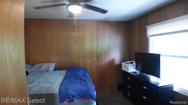2633 Orchard Ln, Flint, MI 48504 - bedroom with wood walls and a ceiling fan