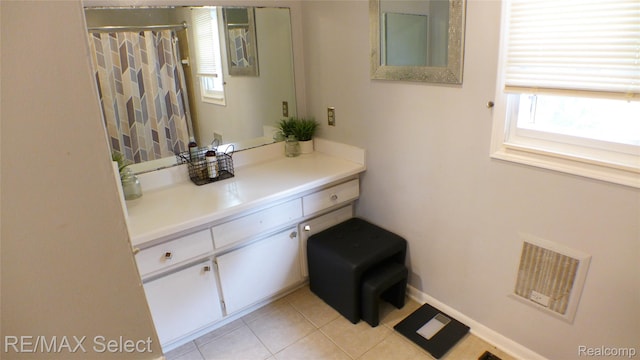 2633 Orchard Ln, Flint, MI 48504 - bathroom with tile patterned flooring and vanity