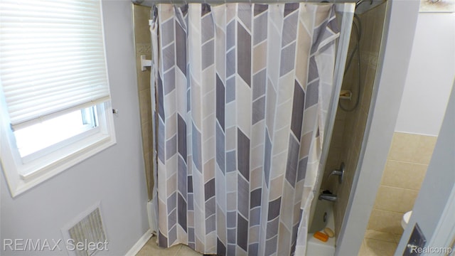 2633 Orchard Ln, Flint, MI 48504 - bathroom with tile walls and tile patterned flooring