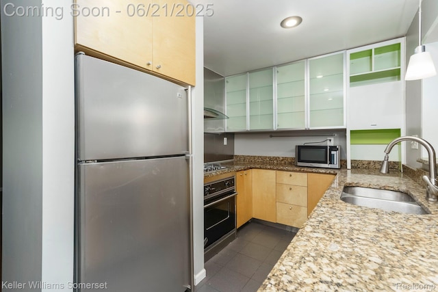 3620 Chester Rd, Royal Oak, MI 48073 - kitchen with stainless steel appliances, light brown cabinets, wall chimney range hood, dark tile patterned flooring, and light stone counters