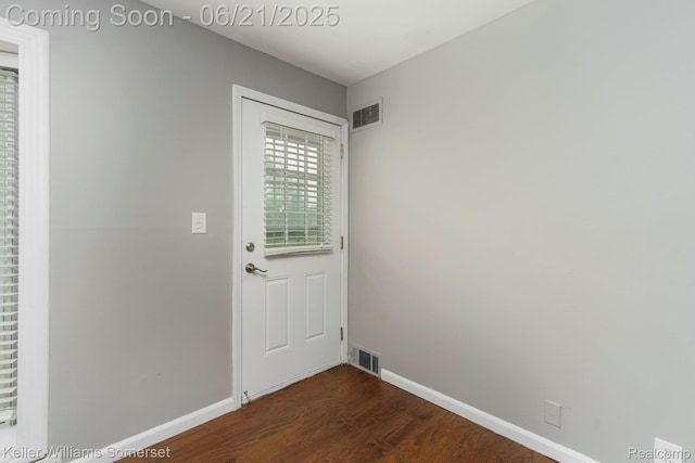 3620 Chester Rd, Royal Oak, MI 48073 - doorway to outside with dark wood-type flooring and baseboards