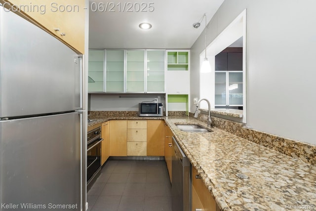 3620 Chester Rd, Royal Oak, MI 48073 - kitchen featuring appliances with stainless steel finishes, dark tile patterned flooring, light stone counters, and light brown cabinets