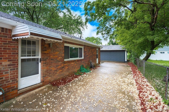 3620 Chester Rd, Royal Oak, MI 48073 - view of side of property with brick siding, a garage, and an outbuilding