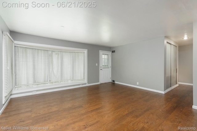 3620 Chester Rd, Royal Oak, MI 48073 - unfurnished living room with baseboards and wood finished floors