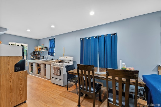 17304 Barlow St, Detroit, MI 48205 - kitchen featuring gas range gas stove, fridge, light wood-style flooring, and recessed lighting