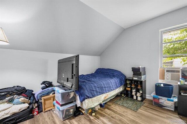 17304 Barlow St, Detroit, MI 48205 - bedroom featuring wood finished floors, lofted ceiling, and cooling unit