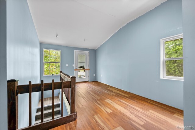17304 Barlow St, Detroit, MI 48205 - empty room featuring vaulted ceiling and wood finished floors