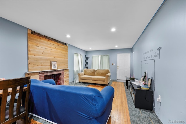 17304 Barlow St, Detroit, MI 48205 - living room with hardwood / wood-style flooring, recessed lighting, and a brick fireplace