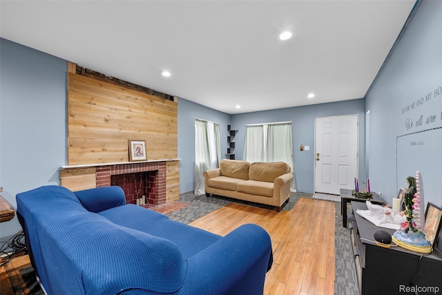 17304 Barlow St, Detroit, MI 48205 - living area featuring recessed lighting, wood finished floors, and a brick fireplace