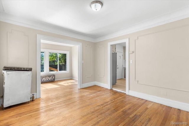 3225 Leslie St, Detroit, MI 48238 - unfurnished room featuring light wood-style floors and ornamental molding