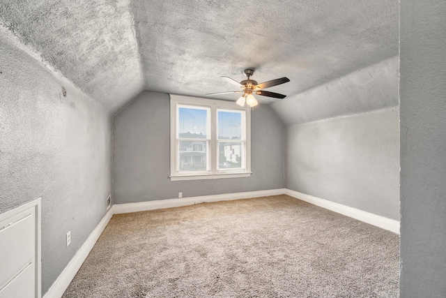 269 Euclid St, Mount Clemens, MI 48043 - bonus room with vaulted ceiling, a textured ceiling, a textured wall, ceiling fan, and carpet floors