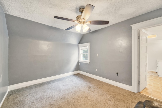 269 Euclid St, Mount Clemens, MI 48043 - empty room featuring a ceiling fan, carpet, lofted ceiling, and a textured ceiling