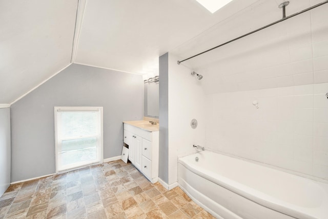 269 Euclid St, Mount Clemens, MI 48043 - full bathroom featuring stone finish floors, vanity, bathtub / shower combination, and vaulted ceiling
