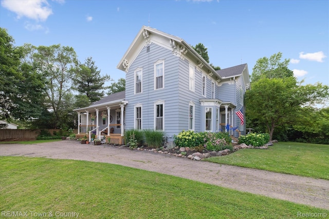 6501 River Rd, Flushing, MI 48433 - italianate house with a porch