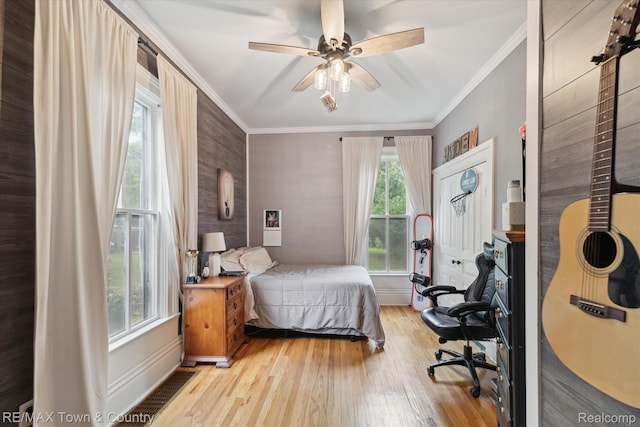 6501 River Rd, Flushing, MI 48433 - bedroom featuring wood finished floors, crown molding, and a ceiling fan