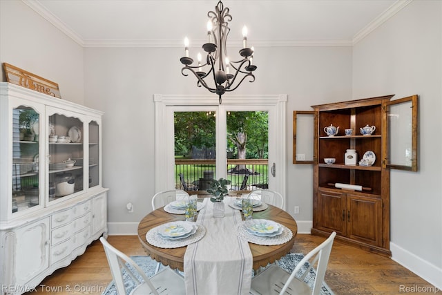 6501 River Rd, Flushing, MI 48433 - dining room featuring a chandelier, wood finished floors, and ornamental molding