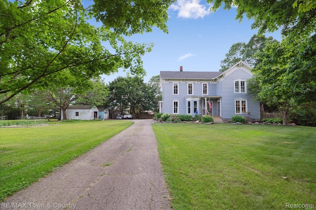 6501 River Rd, Flushing, MI 48433 - italianate-style house with a chimney