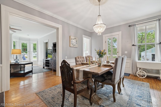 6501 River Rd, Flushing, MI 48433 - dining room with a chandelier, light wood-style floors, plenty of natural light, crown molding, and a ceiling fan