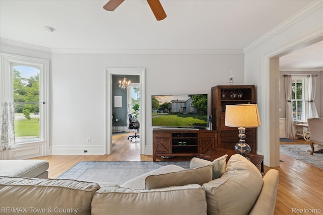 6501 River Rd, Flushing, MI 48433 - living room featuring ornamental molding, plenty of natural light, wood finished floors, and ceiling fan