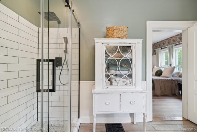 6501 River Rd, Flushing, MI 48433 - bathroom with a stall shower, connected bathroom, and a wainscoted wall