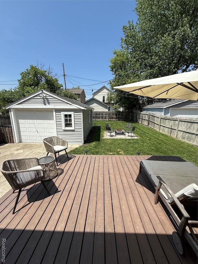 3355 Garden Ave, Royal Oak, MI 48073 - deck featuring an outdoor fire pit, an outdoor structure, a fenced backyard, and a detached garage