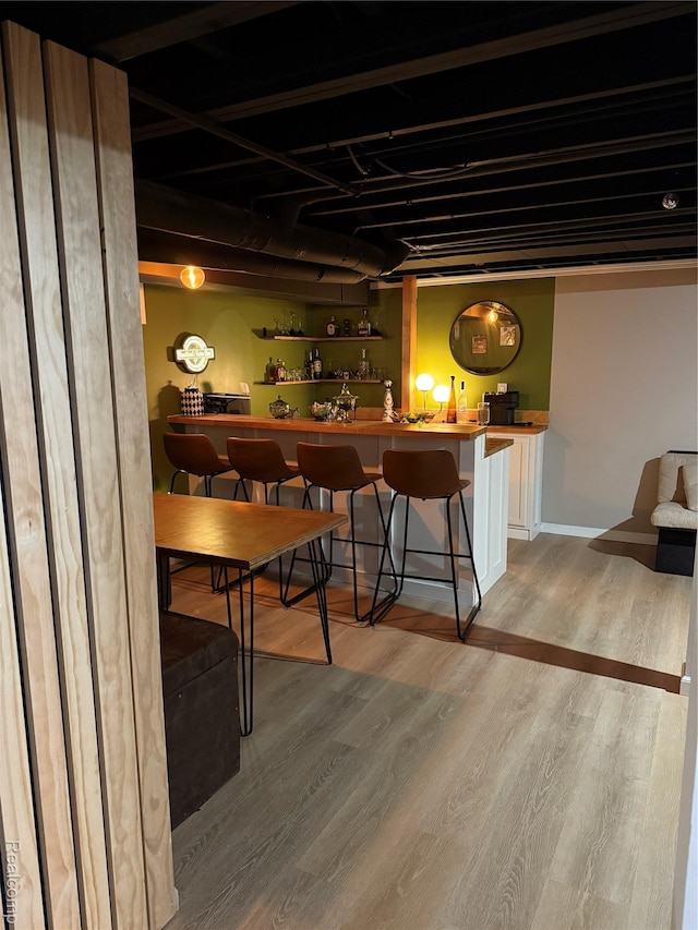 3355 Garden Ave, Royal Oak, MI 48073 - dining area with light wood-type flooring and bar