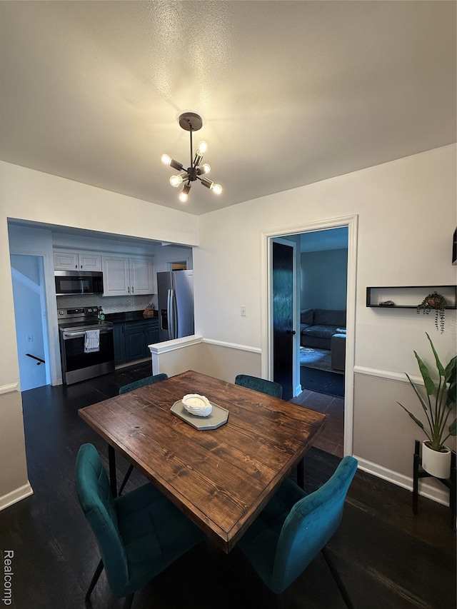 3355 Garden Ave, Royal Oak, MI 48073 - dining area with a chandelier and dark wood finished floors