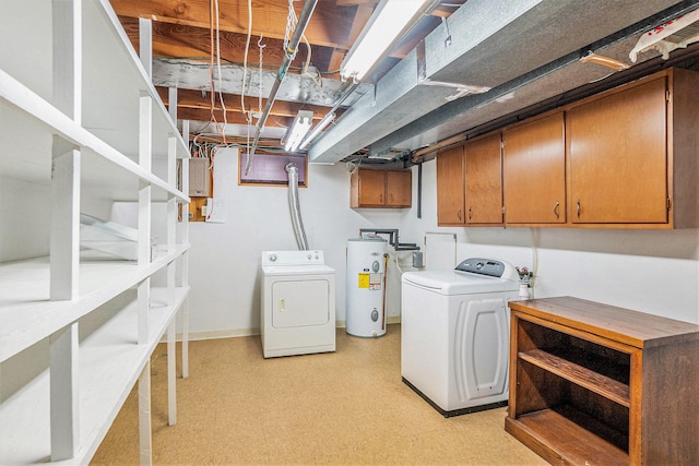 15770 157th Ave, Big Rapids, MI 49307 - washroom featuring washing machine and clothes dryer, electric water heater, light flooring, and cabinet space