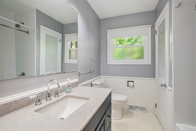 15770 157th Ave, Big Rapids, MI 49307 - bathroom with a closet, wainscoting, vanity, and a shower