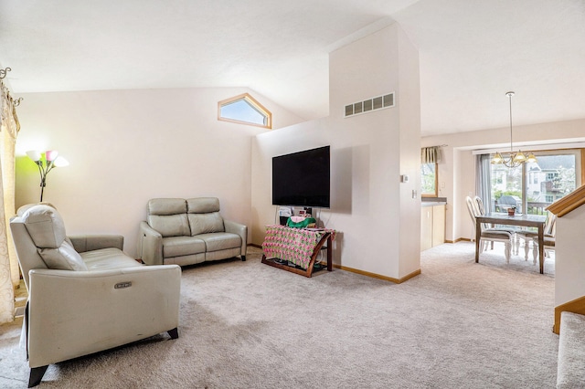 5767 E Grove Dr SE, Kentwood, MI 49512 - carpeted living room featuring a chandelier and vaulted ceiling