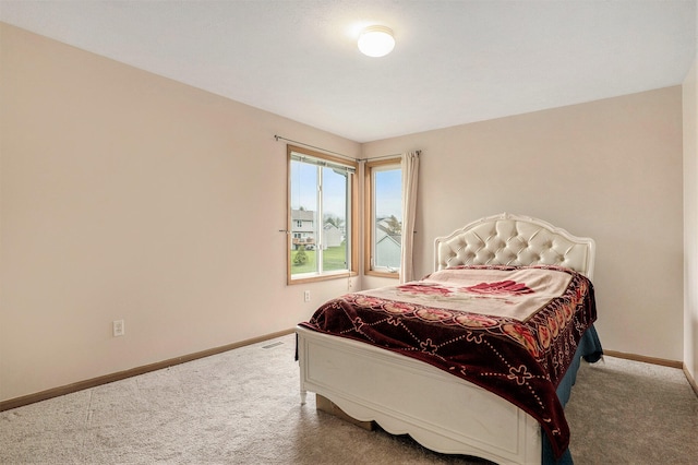 5767 E Grove Dr SE, Kentwood, MI 49512 - carpeted bedroom featuring baseboards