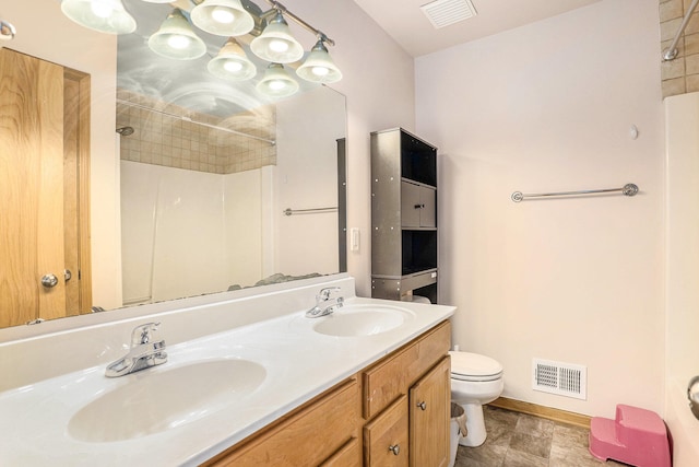 5767 E Grove Dr SE, Kentwood, MI 49512 - full bathroom with a shower and double vanity