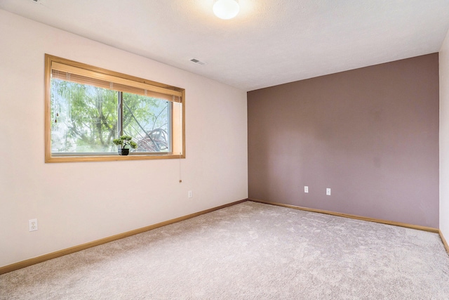 5767 E Grove Dr SE, Kentwood, MI 49512 - carpeted spare room with baseboards
