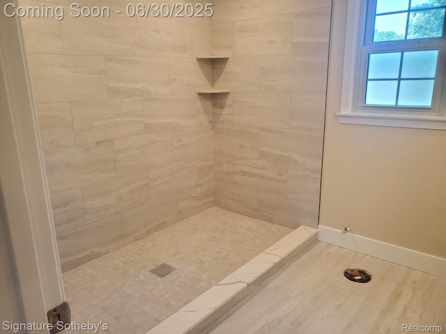 2200 Brenthaven Dr E, Bloomfield, MI 48304 - bathroom with a tile shower and baseboards